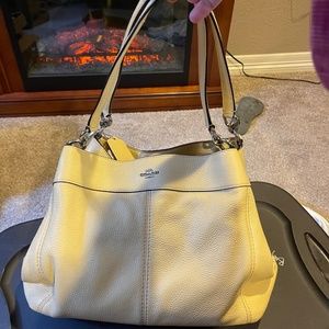 Soft yellow large leather coach bag with matching wallet